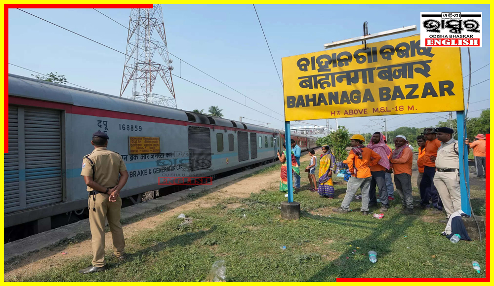 Spectators Watch as Coromandel Express Slowly Navigates Odisha Train Crash Spot